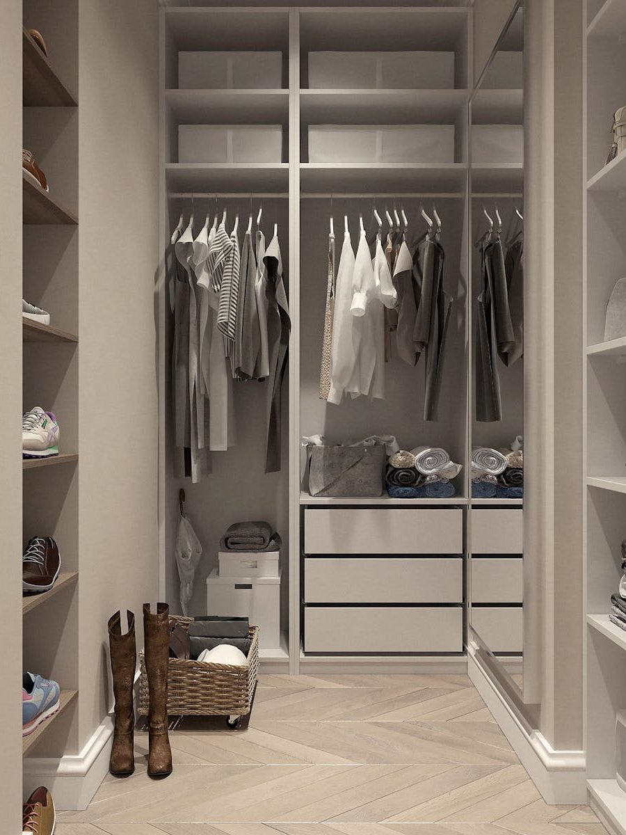 Stylish walk-in closet with neutral tones and contemporary design elements.